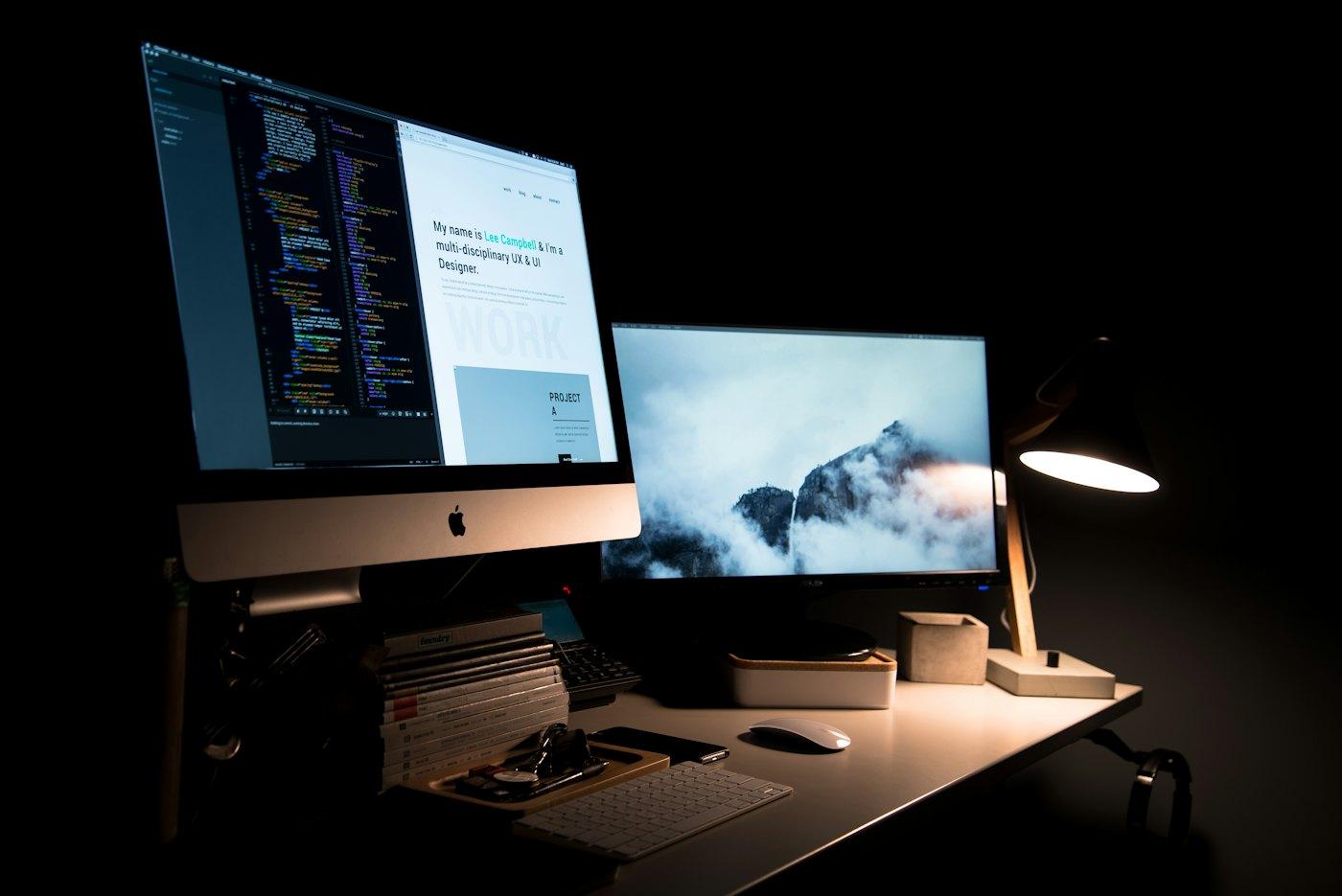Hands adjusting a website layout on a laptop