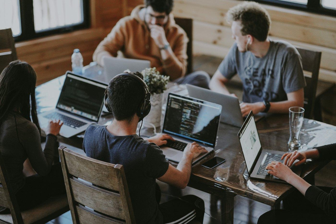 A small team working together at laptops